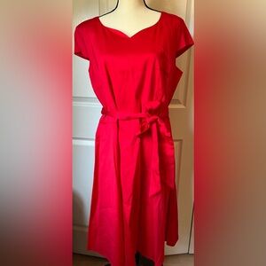 Dress Tells 3X red dress with cap sleeves, belt, and back zipper closure.